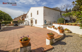 Catalan Masia keeping original construction of that time, wooden beams, hydraulic tile floors